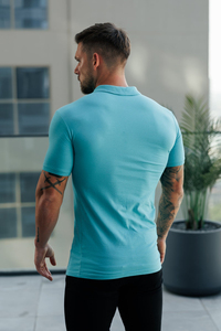 เสื้อโปโลผู้ชายทรงสลิมฟิตแขนสั้นสีพื้นผ้าถักลำลองสีฟ้าอ่อน - Product Image 4