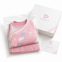 Tenue de cheerleading personnalisée pour femmes, jupe plissée rose et haut sans manches, maille respirante, vêtements de compétition de cheerleading