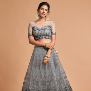 El lehenga semicompuesto en forma de A está hecho de tela de red suave de primera calidad y adornado con intrincados detalles de hilo zari badla dori. - Product Image 3