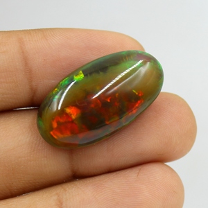 โอปอลเอธิโอเปียสีดำธรรมชาติ 22.00 กะรัต แบบคาโบชอง หลายสี ไฟหลากสี ผิวเรียบ ไม่มีตัวเรือน ใช้เป็นพลอยประจำเดือนตุลาคม ขนาด: 29X16X9 มม. - Product Image 3