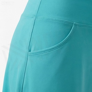 Jupe courte asymétrique taille haute pour femme avec poches, couleur unie, style sportif, tissu respirant en spandex et polyester - Product Image 5