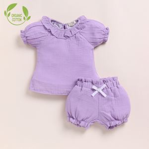 Conjunto de ropa de bebé con volantes y muselina orgánica de primera calidad para recién nacidos - Product Image 1