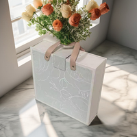 Boîte cadeau en EVA de luxe en forme de livre, avec logo en feuille d'or, texture gaufrée élégante, laminage mat pour crème pour le visage, produits de luxe personnalisés