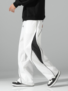 Pantalon de survêtement blanc surdimensionné pour homme, coupe large, avec empiècements latéraux contrastants noirs et détails de passepoil, taille à cordon de serrage – Vente en gros personnalisée - Product Image 5