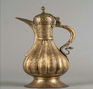Antique style fluted metal Dallah coffee pot with intricate engravings, available at wholesale prices for classic home decor. - Product Image 1