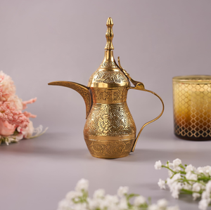 Classic etched brass coffee pot with traditional Arabic engravings, available at wholesale prices for authentic kitchenware. - Product Image 1