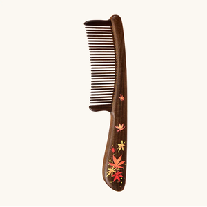 Dark polished <b>wooden</b> <b>comb</b> decorated with colorful autumn leaf motifs and a comfortable handle, available at wholesale prices. - Product Image 1