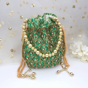 Bolso Potli de seda verde hecho a mano con bordado de cuentas doradas y detalles de perlas para ocasiones de boda por AALIYAN IMPEX. - Product Image 1