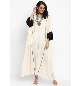 Luxurious Ivory And Black Contrast Trimmings Loose Fit Cotton Kaftan Dress With Cuff Sleeves And Two Spacious Side Pockets
