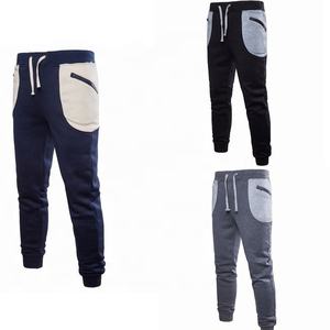 กางเกงวอร์มนักวิ่งผู้ชาย,กางเกงวอร์มนักวิ่งลำลองกีฬามีกระเป๋าผ้าฟรีซ - Product Image 1