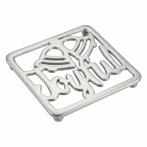 Wholesale Heavy Duty Cast Iron <b>Trivet</b> with Feet Hollow Out Christmas Bell <b>Trivet</b> Heat Resistant Decorative Metal <b>Trivet</b> Hot Pot - Product Image 1