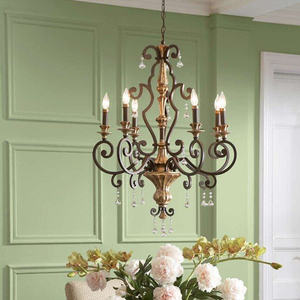 Un exquisito candelabro antiguo de bronce diseñado con brazos decorados con motivos curvilíneos y cuentas de cristal transparente, disponible a precios de mayorista. - Product Image 1