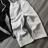 Pantalon de jogging personnalisé avec logo brodé, design rayé décontracté, coupe évasée et ample, en coton, style baggy