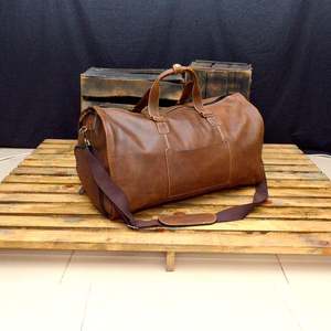 กระเป๋าเดินทางหนังวัวแท้สไตล์เรโทร ขนาด 36-55 ลิตร น้ำหนักเบา พกพาสะดวก สำหรับเดินทางท่องเที่ยวหรือธุรกิจ รุ่น LDB-0305 เหมาะสำหรับทั้งชายและหญิง - Product Image 1