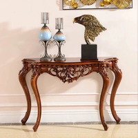 Console de style victorien en forme de demi-lune avec des sculptures florales complexes, pieds cabriolés classiques, en acajou massif, pour salon ou hôtel