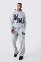 Ensemble de survêtement streetwear personnalisé délavé à l'acide, comprenant un sweat à capuche zippé et un pantalon de survêtement évasé avec patchs effet vieilli