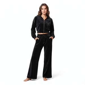 Conjunto de dos piezas de terciopelo para mujer: Top corto con cremallera, manga larga, hombros caídos y pantalón jogger de pierna ancha. Venta al por mayor. - Product Image 1