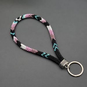 เราจำหน่ายสินค้าส่งออก เชือกคล้องมือประดับมุกเทียมทำมือสำหรับผู้หญิง ดีไซน์ทันสมัย สีชมพู เทอร์ควอยซ์ ดำ ขาว ลายเงิน - Product Image 6