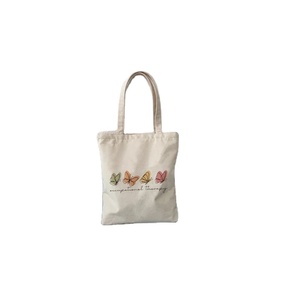Sac fourre-tout de luxe en toile de coton blanc avec poignée bleue sac cadeau vierge recyclable pour shopping ou cadeau, vente en gros - Product Image 1