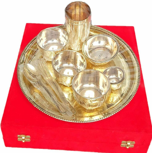 Minimalist golden bronze Kansa dinnerware set featuring delicate printed <b>border</b> motifs on the thali and bowls. - Product Image 2