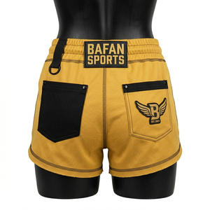 Shorts de mujer de alta calidad en poliéster y spandex, color amarillo, con costuras en contraste, bolsillo con cremallera, logotipo bordado en parche. - Product Image 4