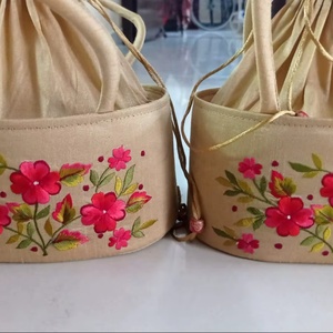 Elegant Handcrafted Floral Embroidered Potli Bag Set Traditional Golden Silk <b>Wristlet</b> with Vibrant Pink Blossom Artistry - Product Image 1