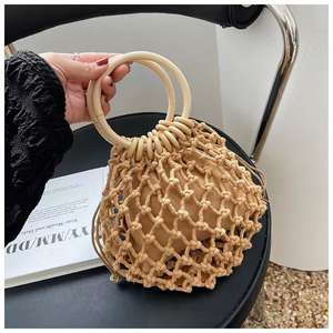 Nouveau sac à main pour femme en crochet tressé ajouré, élégant et polyvalent, avec fermeture éclair de style vintage et bandoulière unique, idéal pour les voyages - Product Image 1
