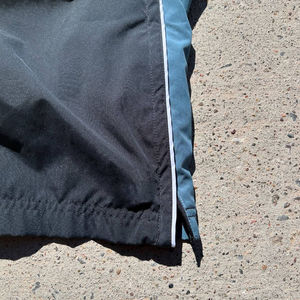 Wholesale Custom Unisex <b>Nylon</b> Windbreaker <b>Pants</b> Lightweight Water Resistant Sports <b>Track</b> <b>Pants</b> With Side Piping And Drawstring - Product Image 6