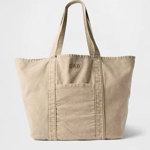 Bolsa de compras de lona de algodón lavado beige al por mayor, de gran capacidad, con bolsillo frontal, para compras, playa, viajes. - Product Image 1