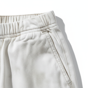 Jogging en toile blanche délavée à l'acide pour hommes. Fabriqués en toile de coton 100% premium, ces pantalons amples et légers offrent une touche unique. - Product Image 2