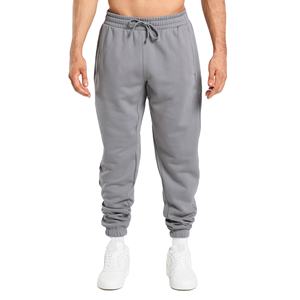 Joggers de gimnasio de algodón ajustados para hombre, ropa deportiva informal con logotipo personalizado y tela de lona para correr al aire libre y pantalones de chándal - Product Image 1