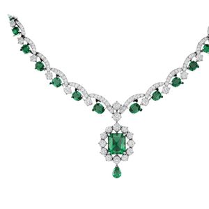 Exquisite luxury <b>necklace</b> in 18K white gold with emerald green center stones and round diamonds in elegant floral inspired - Product Image 1