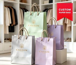 Sacs en papier personnalisés pour l'emballage de vêtements et de bijoux, sacs de shopping en papier personnalisés de qualité supérieure avec logo en relief, vente en gros - Product Image 1