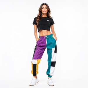 Pantalon de jogging décontracté pour homme, color block, avec empiècements, taille élastique et cordon de serrage, respirant, en polyester tricoté, idéal pour le printemps - Product Image 1