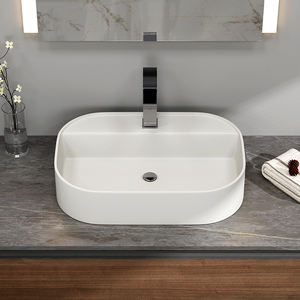 Lavabo ovale blanc mat Maydon en surface solide, moderne, 600 mm, pour salle de bain, à poser sur le comptoir - Product Image 1