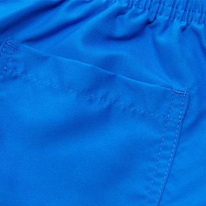 กางเกงขาสั้นว่ายน้ำสำหรับฤดูร้อน รุ่นใหม่ เป็นมิตรกับสิ่งแวดล้อม สวมใส่สบาย เหมาะสำหรับเล่นกระดานโต้คลื่นและชายหาด ผลิตตามแบบ OEM ป้องกันรังสียูวี แห้งเร็ว กันลม ระบายอากาศได้ดี ผลิตจากผ้าวอร์สเตด - Product Image 6