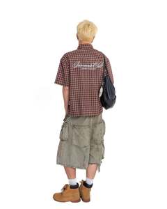 เสื้อเชิ้ตแขนสั้นทรงบ็อกซี่ คอปกแบบไม่มีปก ลายตาราง ผ้าฝ้าย 100% ระบายอากาศได้ดี เป็นมิตรกับสิ่งแวดล้อม ปักลาย สำหรับวันหยุดฤดูร้อน ผู้ชาย ผู้หญิง รับผลิตแบบ OEM ODM - Product Image 4