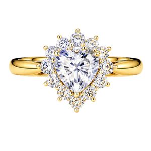 Elegant heart shaped halo engagement ring brilliant lab grown diamond surrounded by round cut halo crafted in premium 18K yellow - Product Image 1
