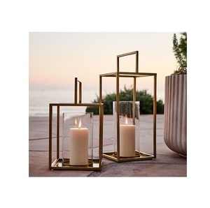 Contemporary metal <b>candle</b> <b>lantern</b> created for premium ambiance enhancement in homes patios and dining spaces - Product Image 1