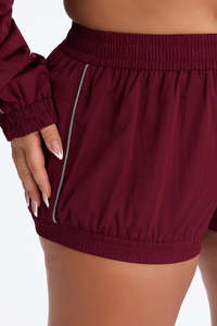 Wholesale Women’s Burgundy Two Piece Windbreaker Set with Full <b>Zip</b> Athletic Jacket and Matching High Waist <b>Shorts</b> Reflective Set - Product Image 2