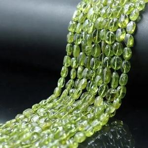 Cuentas ovaladas lisas de 14 pulgadas de alta calidad, piedras preciosas sueltas de peridoto natural para la fabricación de joyas - Product Image 1