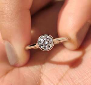 Modern round bezel solitaire <b>diamond</b> <b>ring</b> with sleek minimalist setting luxury bridal engagement anniversary fine jewelry design - Product Image 1