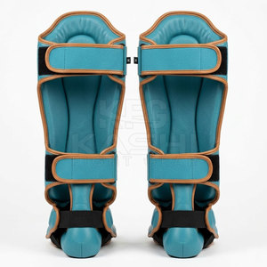 Protège-tibias en cuir PU de qualité professionnelle, légers, avec zone de couverture renforcée et doublure respirante pour la boxe (longue durée) - Product Image 2