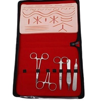 Kit d'entraînement à la suture avec coussinet en silicone et instruments recouverts de PVC pour la formation chirurgicale des étudiants en médecine