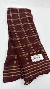 A lightweight, semi-sheer fabric with a slightly crinkled texture A pattern <b>formed</b> by intersecting horizontal and vertical lines - Product Image 4
