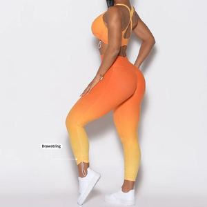 Ensemble de yoga 2 pièces pour femme : Crop top orange à bretelles croisées et leggings taille haute longueur cheville, sans couture, avec cordon de serrage, en Spandex et Polyester - Product Image 1