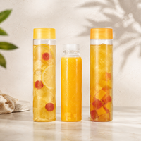 Vente en gros de bouteilles en plastique PET de forme cylindrique longue pour jus, whisky, avec bouchon à vis en PP, qualité alimentaire, logo personnalisé, bouteille en plastique
