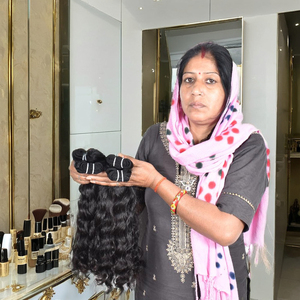 Vente en gros prix usine meilleure qualité 100% cheveux vierges bruts non transformés naturels ondulés couleur noire extensions de cheveux humains indiens - Product Image 1