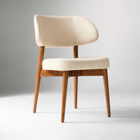 Chaise de salle à manger de style mid-century modern avec assise et dossier en lin rembourrés, pieds en bois massif