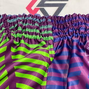 Pantalones Cortos de Muay Thai Fairtex de Último Diseño en Naranja y Negro con Logotipo Bordado y Estampado por Sublimación - Product Image 3